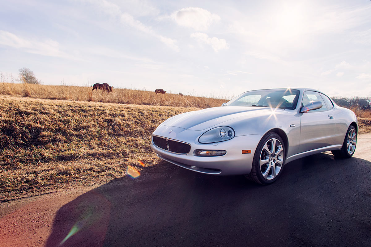 Maserati 4200 Coupe enjoying a rural drive photo from Burbble