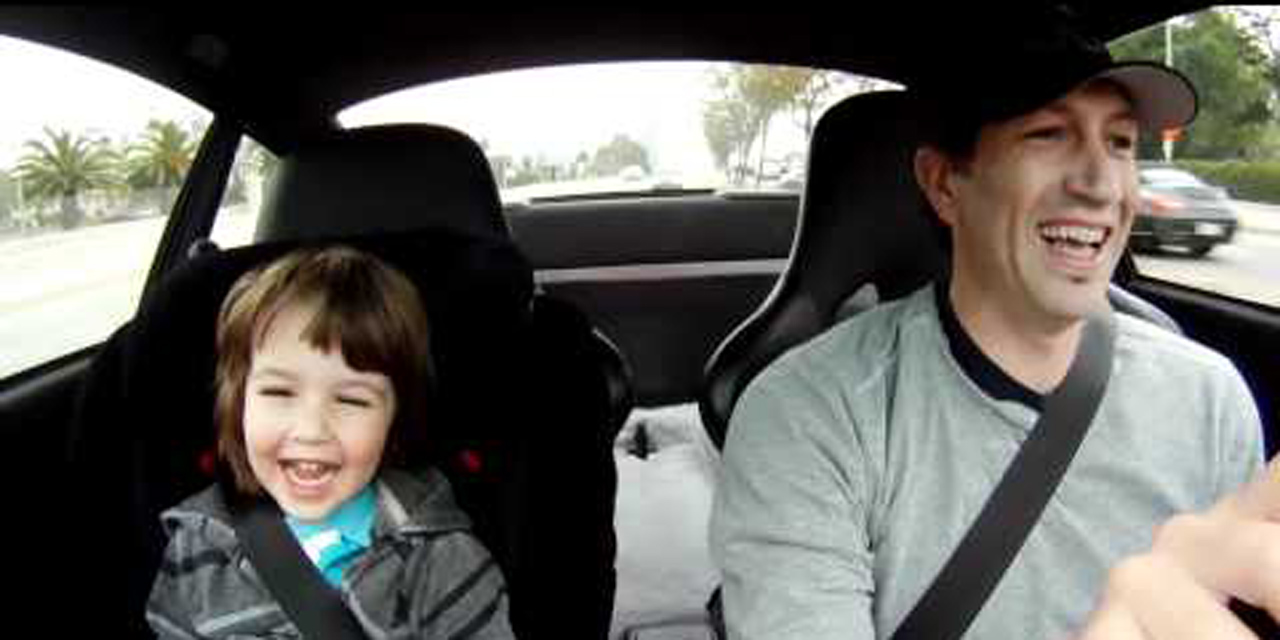 Father and son in a Porsche 911