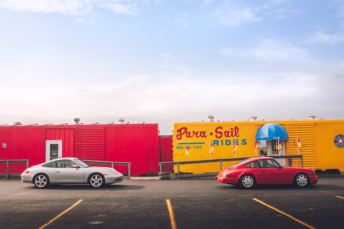 Porsche 911s on a road trip.  Silver 996 and Red 964.