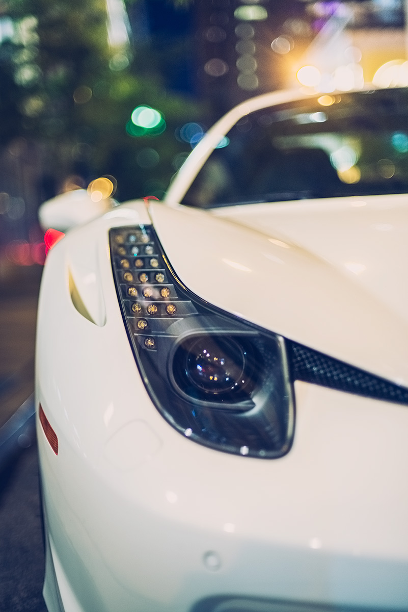 White Ferrari 458 parked in downtown Chicago at night