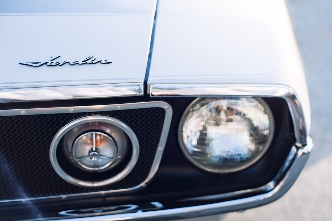 Classic silver AMX Javelin muscle car sunrise