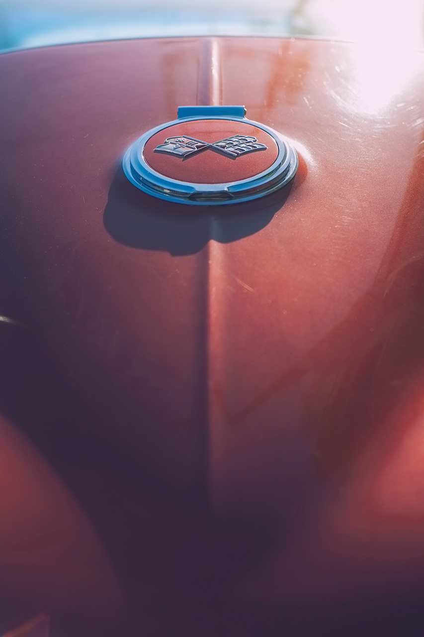 Classic burgundy Corvette Stingray basking in a California glow